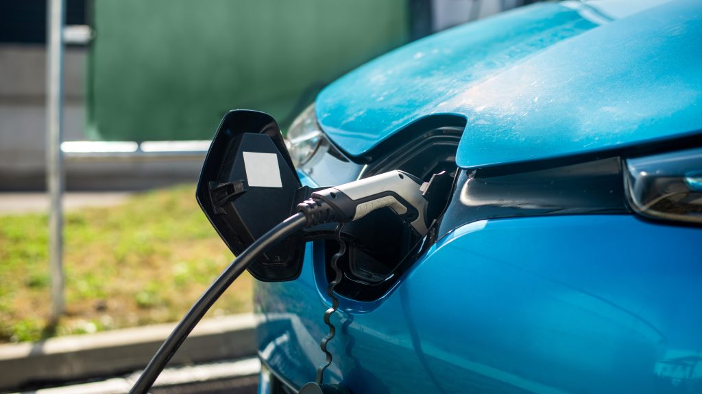 Smash Repairs Phuket Bodywork, Panel Beating & Smash Repairs in Phuket Close View Of A Charger Plugged Into An Electric Car
